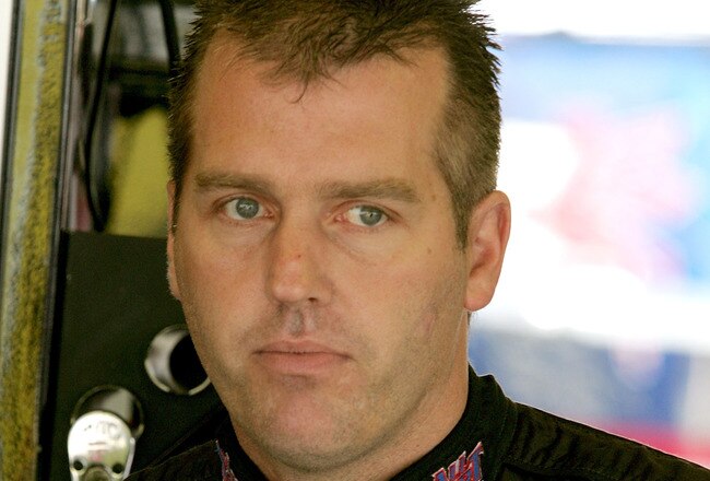 DARLINGTON, SC - MAY 08: Jeremy Mayfield, driver of the #41 SmallSponsor.com Toyota, stands in the garage during practice for the NASCAR Sprint Cup Series Southern 500 on May 8, 2009 at Darlington Raceway in Darlington, South Carolina.  (Photo by Jerry Markland/Getty Images for NASCAR)