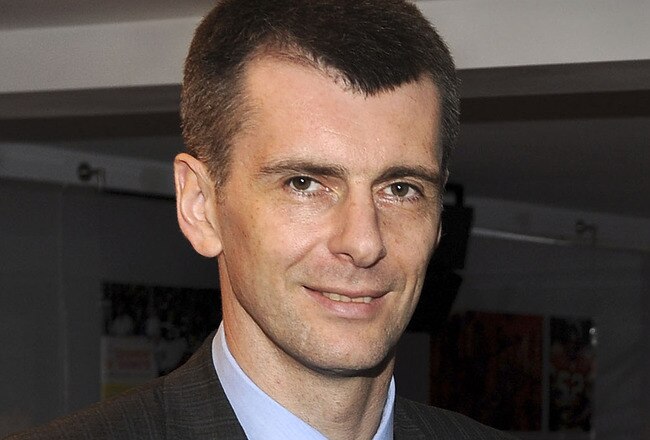 NEW YORK - MAY 18:  (EXCLUSIVE) Nets owner Mikhail Prokhorov with cultural icon and Nets investor JAY-Z celebrate Prokhorov's purchase of the team at lunch today at JAY-Z's 40/40 club on May 18, 2010 in New York City. Prokhorov is representing the Nets tonight at the NBA Draft Lottery in which the team could secure the first pick.  (Photo by Larry Busacca/Getty Images for New Jersey Nets)