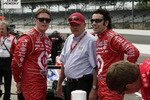 INDIANAPOLIS - MAY 15: Scott Dixon (L) and Dario Franchitti of Chip Ganassi Racing chat with a crew member during opening day at the Indianapolis Motor Speedway on May 15, 2010 in Indianapolis, Indiana.   (Photo by Ron Hoskins/Getty Images)