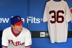 PHILADELPHIA - MAY 06:  Jamie Moyer #50 of the Philadelphia Phillies sits in the dugout next to a jersey of Phillies Hall of Fame pitcher Robin Roberts prior to playing the St. Louis Cardinals at Citizens Bank Park on May 6, 2010 in Philadelphia, Pennsylvania. Roberts passed away today at the age of 83.  (Photo by Jim McIsaac/Getty Images)