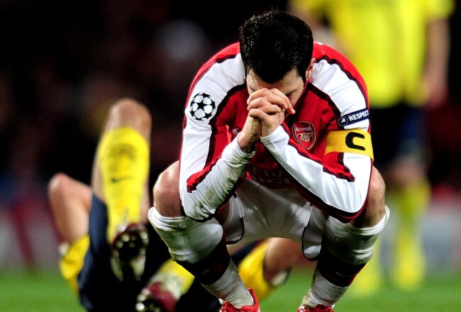 LONDON, ENGLAND - MARCH 31:  Cesc Fabregas of Arsenal reacts after being shown a yellow card by referee Massimo Busacca of Switerland during the UEFA Champions League quarter final first leg match between Arsenal and FC Barcelona at the Emirates Stadium on March 31, 2010 in London, England. Cesc Fabregas of Arsenal will now miss the next match at the Camp Nou in Barcelona.  (Photo by Shaun Botterill/Getty Images)