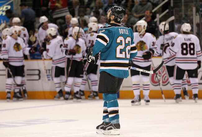 SAN JOSE, CA - MAY 18:  Dan Boyle #22 of the San Jose Sharks reacts after a second period goal was scored by Jonathan Toews #19 of the Chicago Blackhawks in Game Two of the Western Conference Finals during the 2010 NHL Stanley Cup Playoffs at HP Pavilion on May 18, 2010 in San Jose, California.  (Photo by Jed Jacobsohn/Getty Images)