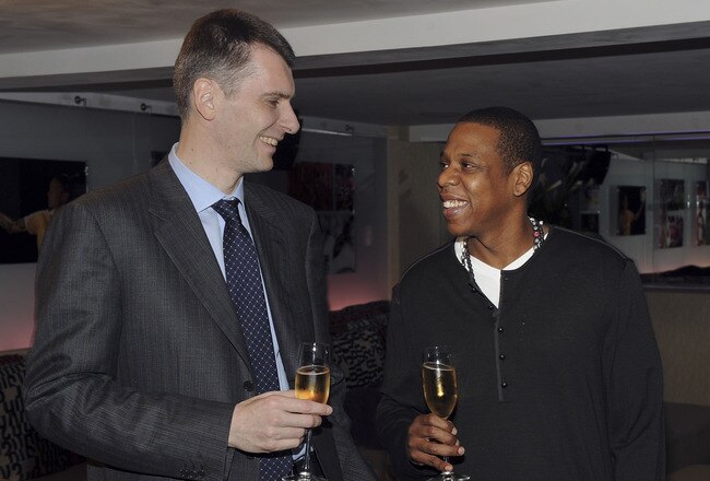 NEW YORK - MAY 18:  (EXCLUSIVE) Nets owner Mikhail Prokhorov with cultural icon and Nets investor JAY-Z celebrate Prokhorov's purchase of the team at lunch today at JAY-Z's 40/40 club on May 18, 2010 in New York City. Prokhorov is representing the Nets tonight at the NBA Draft Lottery in which the team could secure the first pick.  (Photo by Larry Busacca/Getty Images for New Jersey Nets)