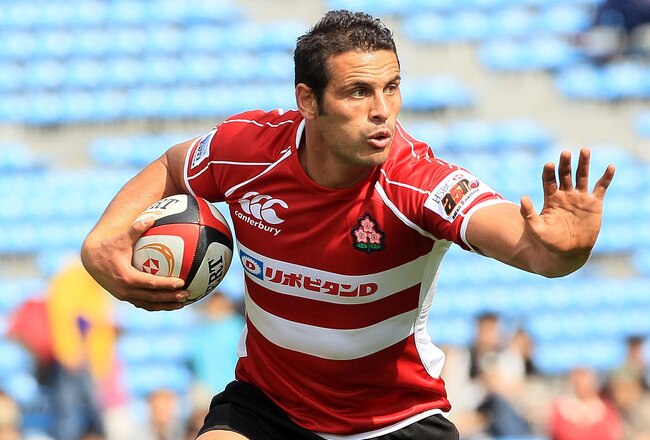 TOKYO - MAY 15:  Ryan Nicholas of Japan runs the ball during the HSBC Asian 5 Nations match between Japan and Kazakhstan at Prince Chichibu Stadium on May 15, 2010 in Tokyo, Japan.  (Photo by Junko Kimura/Getty Images)