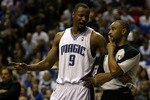 ORLANDO, FL - MAY 16:  Rashard Lewis #9 of the Orlando Magic talks with referee Dan Crawford against the Boston Celtics in Game One of the Eastern Conference Finals during the 2010 NBA Playoffs at Amway Arena on May 16, 2010 in Orlando, Florida.  NOTE TO USER: User expressly acknowledges and agrees that, by downloading and/or using this Photograph, user is consenting to the terms and conditions of the Getty Images License Agreement.  (Photo by Doug Benc/Getty Images)