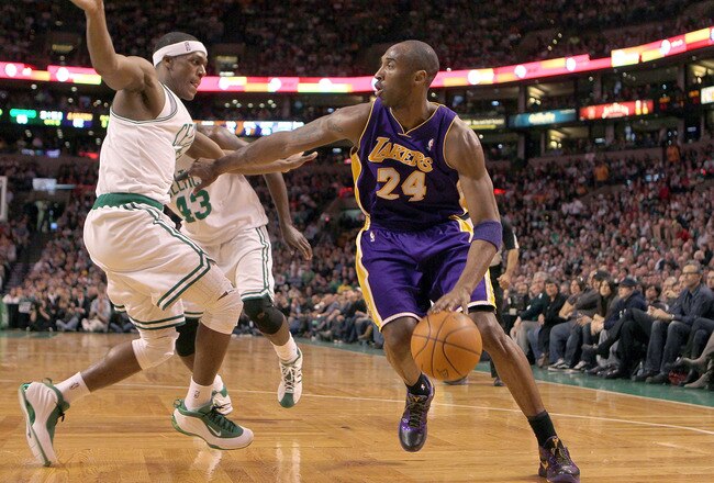 BOSTON - JANUARY 31:  Kobe Bryant  #24 of the Los Angeles Lakers drives to the basket against the defense of  Rajon Rondo #9 of the Boston Celtics in the second half at the TD Garden on January 31, 2010 in Boston, Massachusetts.  The Lakers won 90-89. NOTE TO USER: User expressly acknowledges and agrees that, by downloading and or using this photograph, User is consenting to the terms and conditions of the Getty Images License Agreement. (Photo by Jim Rogash /Getty Images)