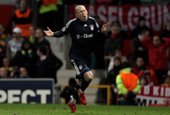 MANCHESTER, ENGLAND - APRIL 07:  Arjen Robben of Bayern Muenchen celebrates scoring his team's second goal during the UEFA Champions League Quarter Final second leg match between Manchester United and Bayern Muenchen at Old Trafford on April 7, 2010 in Manchester, England.  (Photo by Alex Livesey/Getty Images)