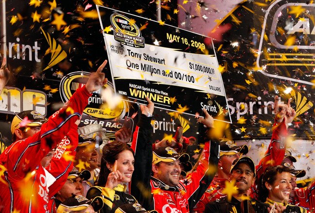 CONCORD, NC - MAY 16:  Tony Stewart, driver of the #14 Office Depot Chevrolet, celebrates in victory lane after winning the NASCAR Sprint All-Star Race on May 16, 2009 at Lowe's Motor Speedway in Concord, North Carolina.  (Photo by Chris Graythen/Getty Images)