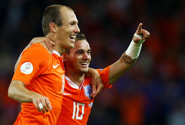 BERNE, SWITZERLAND - JUNE 13:  Wesley Sneijder of Netherlands celebrates with Arjen Robben after scoring his teams fourth goal during the UEFA EURO 2008 Group C match between Netherlands and France at Stade de Suisse Wankdorf on June 13, 2008 in Berne, Switzerland.  (Photo by Ian Walton/Getty Images)