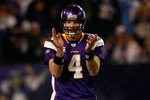MINNEAPOLIS - JANUARY 17:  Quarterback Brett Favre #4 of the Minnesota Vikings celebrates a first down while playing against the Dallas Cowboys during the NFC Divisional Playoff Game at Hubert H. Humphrey Metrodome on January 17, 2010 in Minneapolis, Minnesota. The Vikings defeated the Cowboys 34-3.  (Photo by Elsa/Getty Images)