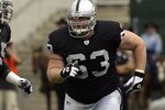 OAKLAND, CA  - SEPTEMBER 28:  Center Barrett Robbins #63 of the Oakland Raiders runs to block during a game against the San Diego Chargers on September 28, 2003 at Network Associates Coliseum in Oakland, California. The Raiders defeated the Chargers 34-31 in overtime. (Photo by Stephen Dunn/Getty Images)
