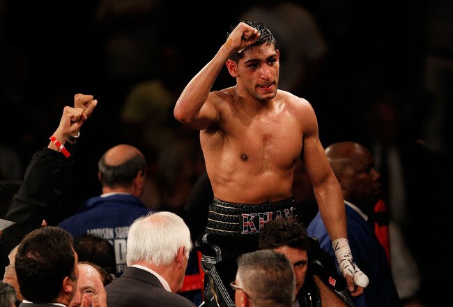 NEW YORK - MAY 15:  Amir Khan of Great Britain celebrates after defeating Paulie Malignaggi by TKO in the 11th round of his WBA light welterweight title fight at Madison Square Garden on May 15, 2010 in New York City.  (Photo by Chris Trotman/Getty Images)