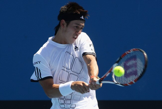 MELBOURNE, AUSTRALIA - JANUARY 20:  Kei Nishikori of Japan plays a backhand in his first round match against Jurgen Melzer of Austria during day two of the 2009 Australian Open at Melbourne Park on January 20, 2009 in Melbourne, Australia.  (Photo by Mark Dadswell/Getty Images)
