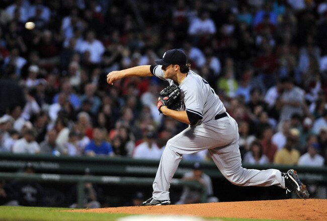 BOSTON, MA - MAY 7:  Phil Hughes # 65 of the New York Yankees delivers a pitch during the third inning against the Boston Red Sox May 7, 2010 at Fenway Park in Boston, Massachusetts. (Photo by Darren McCollester/Getty Images)