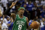 ORLANDO, FL - MAY 16:  Rajon Rondo #9 of the Boston Celtics gestures as he brings the ball up court against the Orlando Magic in Game One of the Eastern Conference Finals during the 2010 NBA Playoffs at Amway Arena on May 16, 2010 in Orlando, Florida.  NOTE TO USER: User expressly acknowledges and agrees that, by downloading and/or using this Photograph, user is consenting to the terms and conditions of the Getty Images License Agreement.  (Photo by Doug Benc/Getty Images)