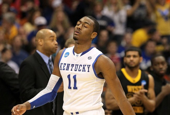 SYRACUSE, NY - MARCH 27:  John Wall #11 of the Kentucky Wildcats walks towards the bench against the West Virginia Mountaineers during the east regional final of the 2010 NCAA men's basketball tournament at the Carrier Dome on March 27, 2010 in Syracuse, New York.  (Photo by Jim McIsaac/Getty Images)