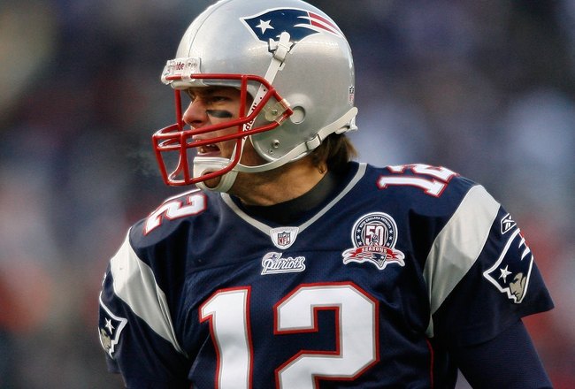 FOXBORO, MA - JANUARY 10:  Tom Brady #12 of the New England Patriots reacts against the Baltimore Ravens during the 2010 AFC wild-card playoff game at Gillette Stadium on January 10, 2010 in Foxboro, Massachusetts. The Ravens won 33-14. (Photo by Elsa/Getty Images)