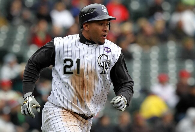 DENVER - MAY 12:  Catcher Miguel Olivo #21 of the Colorado Rockies heads for second on a ground rule double in the fourth inning as he went 5 for 5 including the game winning homerun against the Philadelphia Phillies in the 10th inning at Coors Field on May 12, 2010 in Denver, Colorado. The Rockies defeated the Phillies 4-3 in 10 innings.  (Photo by Doug Pensinger/Getty Images)