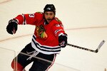 CHICAGO - MAY 23:  Dustin Byfuglien #33 of the Chicago Blackhawks celebrates his third period goal while taking on the San Jose Sharks in Game Four of the Western Conference Finals during the 2010 NHL Stanley Cup Playoffs at the United Center on May 23, 2010 in Chicago, Illinois.  (Photo by Jonathan Daniel/Getty Images)