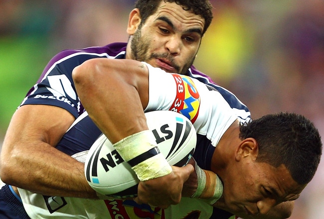 MELBOURNE, AUSTRALIA - MAY 09:  Greg Inglis of the Storm tackles Israel Folau of the Broncos during the round nine NRL match between the Melbourne Storm and the Brisbane Broncos at AAMI Park on May 9, 2010 in Melbourne, Australia.  (Photo by Mark Dadswell/Getty Images)
