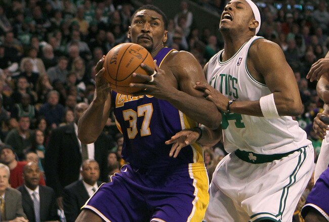 BOSTON - JANUARY 31:  Ron Artest #37 of the Los Angeles Lakers drives toward the basket against the defense of Paul Pierce #34 of the Boston Celtics at the TD Garden on January 31, 2010 in Boston, Massachusetts.  The Lakers won 90-89. NOTE TO USER: User expressly acknowledges and agrees that, by downloading and or using this photograph, User is consenting to the terms and conditions of the Getty Images License Agreement. (Photo by Jim Rogash /Getty Images)