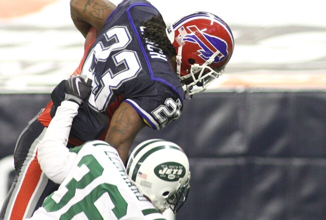 TORONTO - DECEMBER 3: Marshawn Lynch #23 of the Buffalo Bills scores a 15-yard rushing touchdown in the second quarter against Jim Leonhard #36 of the New York Jets at Rogers Centre on December 3, 2009 in Toronto, Canada.  (Photo by Rick Stewart/Getty Images)