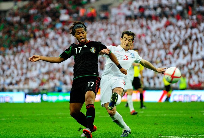 LONDON, ENGLAND - MAY 24: Giovanni Dos Santos of Mexico fights for the ball with Leighton Baines of England during the International Friendly match between England and Mexico at Wembley Stadium on May 24, 2010 in London, England.  (Photo by Jamie McDonald/Getty Images)