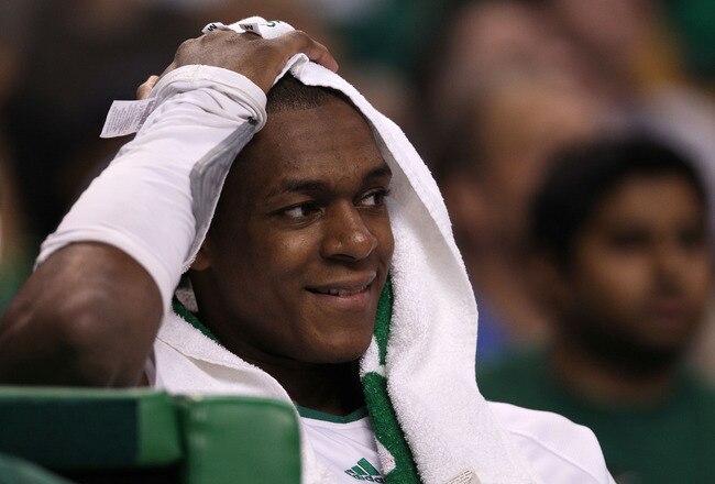 BOSTON - MAY 22:  Rajon Rondo #9 of the Boston Celtics smiles as he looks on from the bench late in the game against the Orlando Magic at TD Banknorth Garden in Game Three of the Eastern Conference Finals during the 2010 NBA Playoffs on May 22, 2010 in Boston, Massachusetts.  NOTE TO USER: User expressly acknowledges and agrees that, by downloading and/or using this Photograph, user is consenting to the terms and conditions of the Getty Images License Agreement.  (Photo by Elsa/Getty Images)