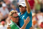 IRVING, TX - MAY 23: Jason Day of Australia embraces caddie Clin Swatton after winning the HP Byron Nelson Championship at TPC Four Seasons Resort Las Colinas on May 23, 2010 in Irving, Texas. (Photo by Darren Carroll/Getty Images)