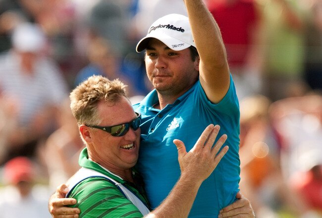 IRVING, TX - MAY 23: Jason Day of Australia embraces caddie Clin Swatton after winning the HP Byron Nelson Championship at TPC Four Seasons Resort Las Colinas on May 23, 2010 in Irving, Texas. (Photo by Darren Carroll/Getty Images)