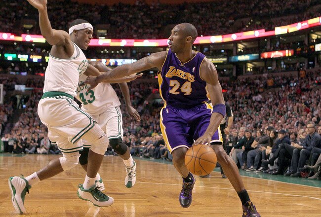 BOSTON - JANUARY 31:  Kobe Bryant  #24 of the Los Angeles Lakers drives to the basket against the defense of  Rajon Rondo #9 of the Boston Celtics in the second half at the TD Garden on January 31, 2010 in Boston, Massachusetts.  The Lakers won 90-89. NOTE TO USER: User expressly acknowledges and agrees that, by downloading and or using this photograph, User is consenting to the terms and conditions of the Getty Images License Agreement. (Photo by Jim Rogash /Getty Images)