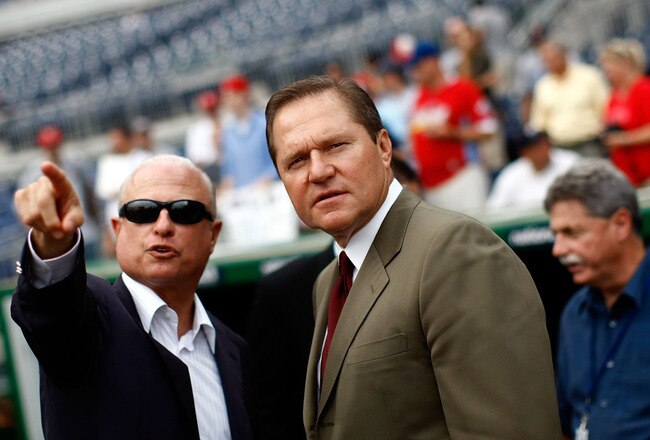 WASHINGTON - AUGUST 21:  Sports agent Scott Boras (R) talks with Washington Nationals principal owner Mark Lerner (L) during pregame warmups at Nationals Park August 21, 2009 in Washington, DC. Boras represents Stephen Strasburg, a right handed pitcher from San Diego State University and the overall first round pick in the 2009 Major League Baseball draft, who signed with the Nationals earlier this week wth a record contract for an amateur player.  (Photo by Win McNamee/Getty Images)