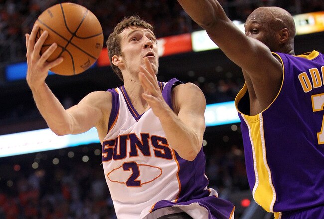PHOENIX - MAY 25:  Goran Dragic #2 of the Phoenix Suns goes up for a shot against Lamar Odom #7 of the Los Angeles Lakers in the fourth quarter of Game Four of the Western Conference Finals during the 2010 NBA Playoffs at US Airways Center on May 25, 2010 in Phoenix, Arizona. NOTE TO USER: User expressly acknowledges and agrees that, by downloading and/or using this Photograph, user is consenting to the terms and conditions of the Getty Images License Agreement.  (Photo by Ronald Martinez/Getty Images)