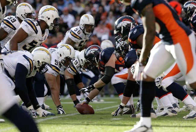 DENVER - NOVEMBER 22:  The Denver Broncos offense faces off against the San Diego Chargers defense on the line of scrimmage during NFL action at Invesco Field at Mile High on November 22, 2009 in Denver, Colorado. The Chargers defeated the Broncos 32-3.  (Photo by Doug Pensinger/Getty Images)
