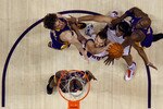 PHOENIX - MAY 25:  Forward Louis Amundson #17 of the Phoenix Suns takes a shot against Kobe Bryant #24, Pau Gasol #16 and Lamar Odom #7 of the Los Angeles Lakers in Game Four of the Western Conference Finals during the 2010 NBA Playoffs at US Airways Center on May 25, 2010 in Phoenix, Arizona. NOTE TO USER: User expressly acknowledges and agrees that, by downloading and/or using this Photograph, user is consenting to the terms and conditions of the Getty Images License Agreement.  (Photo by Ronald Martinez/Getty Images)