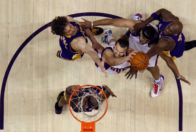 PHOENIX - MAY 25:  Forward Louis Amundson #17 of the Phoenix Suns takes a shot against Kobe Bryant #24, Pau Gasol #16 and Lamar Odom #7 of the Los Angeles Lakers in Game Four of the Western Conference Finals during the 2010 NBA Playoffs at US Airways Center on May 25, 2010 in Phoenix, Arizona. NOTE TO USER: User expressly acknowledges and agrees that, by downloading and/or using this Photograph, user is consenting to the terms and conditions of the Getty Images License Agreement.  (Photo by Ronald Martinez/Getty Images)