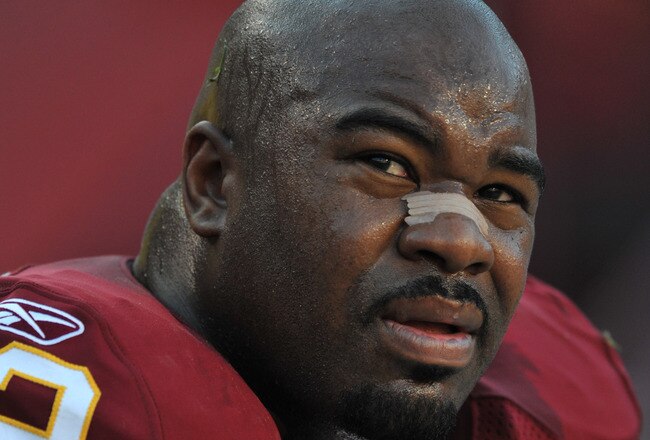 LANDOVER, MD - NOVEMBER 15:  Albert Haynesworth #92 of the Washington Redskins sits on the sidelines during the game against the Denver Broncos at FedExField on November 15, 2009 in Landover, Maryland. The Redskins defeated the Broncos 27-17. (Photo by Larry French/Getty Images)