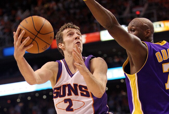 PHOENIX - MAY 25:  Goran Dragic #2 of the Phoenix Suns goes up for a shot against Lamar Odom #7 of the Los Angeles Lakers in the fourth quarter of Game Four of the Western Conference Finals during the 2010 NBA Playoffs at US Airways Center on May 25, 2010 in Phoenix, Arizona. NOTE TO USER: User expressly acknowledges and agrees that, by downloading and/or using this Photograph, user is consenting to the terms and conditions of the Getty Images License Agreement.  (Photo by Ronald Martinez/Getty Images)