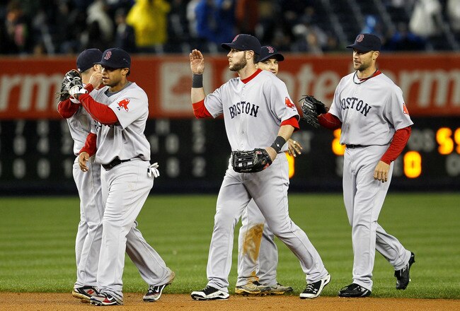 NEW YORK - MAY 18: The Boston Red Sox celebrate a victory over the New York Yankees on May 18, 2010 at Yankee Stadium in the Bronx borough of New York City. The Red Sox defeated the Yankees 7-6. (Photo by Chris Trotman/Getty Images)