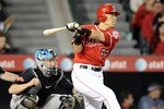 ANAHEIM, CA - MAY 25:  Hideki Matsui #55 of the Los Angeles Angels hits a single in front of John Buck #14 of the Toronto Blue Jays during the seventh inning at Angel Stadium on May 25, 2010 in Anaheim, California.  (Photo by Harry How/Getty Images)