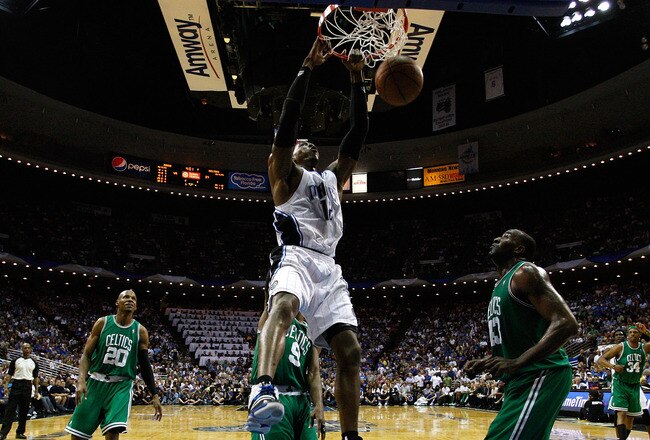 ORLANDO, FL - MAY 26:  Dwight Howard #12 of the Orlando Magic dunks against Kendrick Perkins #43 of the Boston Celtics in Game Five of the Eastern Conference Finals during the 2010 NBA Playoffs at Amway Arena on May 26, 2010 in Orlando, Florida.  NOTE TO USER: User expressly acknowledges and agrees that, by downloading and/or using this Photograph, user is consenting to the terms and conditions of the Getty Images License Agreement.  (Photo by Kevin C. Cox/Getty Images)