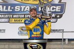 CONCORD, NC - MAY 22:  Martin Truex Jr., driver of the #56 NAPA Auto Parts Toyota, celebrates in Victory Lane after winning the NASCAR Sprint Showdown at Charlotte Motor Speedway on May 22, 2010 in Concord, North Carolina.  (Photo by Tom Whitmore/Getty Images for NASCAR)