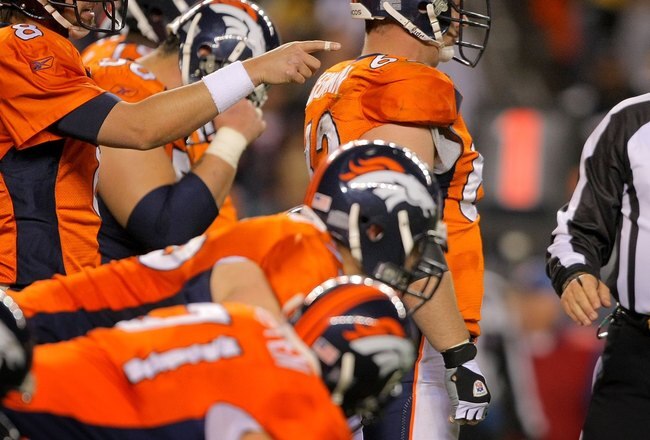 DENVER - NOVEMBER 09:  Quarterback Kyle Orton #8 of the Denver Broncos directs the offense against the Pittsburgh Steelers as umpire Garth DeFelice looks on during NFL action at Invesco Field at Mile High on November 9, 2009 in Denver, Colorado. The Steelers defeated the Broncos 28-10.  (Photo by Doug Pensinger/Getty Images)