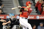 ANAHEIM, CA - MAY 25:  Hideki Matsui #55 of the Los Angeles Angels hits a single in front of John Buck #14 of the Toronto Blue Jays during the seventh inning at Angel Stadium on May 25, 2010 in Anaheim, California.  (Photo by Harry How/Getty Images)