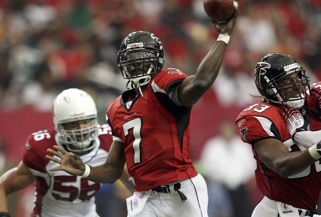 ATLANTA - OCTOBER 01:  Quarterback Michael Vick #7 of the Atlanta Falcons throws a pass against the Arizona Cardinals on October 1, 2006 at the Georgia Dome in Atlanta, Georgia. The Falcons defeated the Cardinals 32-10.  (Photo by Doug Benc/Getty Images)