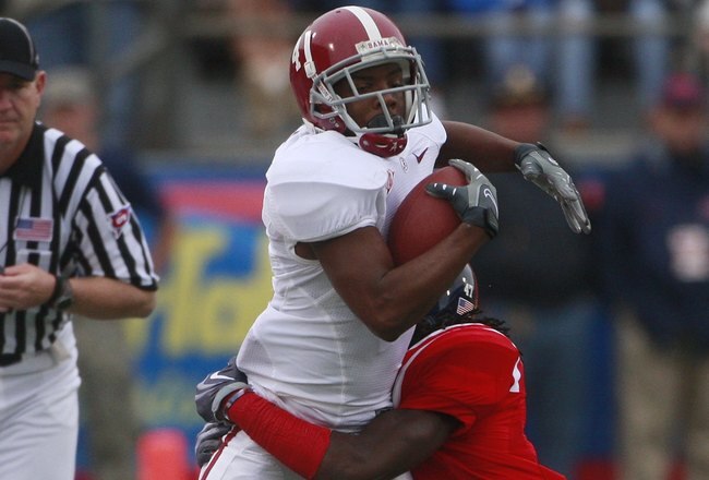 OXFORD, MS - OCTOBER 10:  Receiver Marquis Maze #4 looks for extra yardage during their game against the Mississippi Rebels at Vaught-Hemingway Stadium on October 10, 2009 in Oxford, Mississippi. (Photo by Dave Martin/Getty Images)