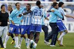 MALAGA, SPAIN - MAY 16:  Players of Malaga celebrate after the La Liga match between Malaga and Real Madrid at La Rosaleda Stadium on May 16, 2010 in Malaga, Spain.  (Photo by Angel Martinez/Getty Images)