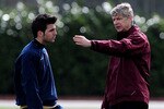 LONDON - APRIL 01:  Arsene Wenger the Arsenal coach talks with Cesc Fabregas during an Arsenal training session at Arsenal's London Colney Training Ground on April 1, 2008 in London, England.  (Photo by Shaun Botterill/Getty Images)