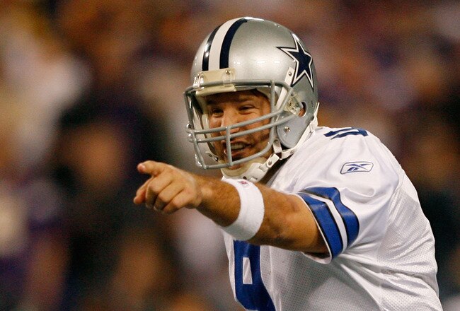 MINNEAPOLIS - JANUARY 17:  Tony Romo #9 of the Dallas Cowboys communicates with his team while playing against the Minnesota Vikings during the second quarter of the NFC Divisional Playoff Game at Hubert H. Humphrey Metrodome on January 17, 2010 in Minneapolis, Minnesota.  (Photo by Elsa/Getty Images)