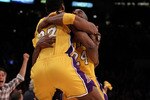LOS ANGELES, CA - MAY 27:  Ron Artest #37 and Kobe Bryant #24 of the Los Angeles Lakers celebrate Artest's game winning shot against the Phoenix Suns in the fourth quarter of Game Five of the Western Conference Finals during the 2010 NBA Playoffs at Staples Center on May 27, 2010 in Los Angeles, California. NOTE TO USER: User expressly acknowledges and agrees that, by downloading and/or using this Photograph, user is consenting to the terms and conditions of the Getty Images License Agreement.  (Photo by Stephen Dunn/Getty Images)